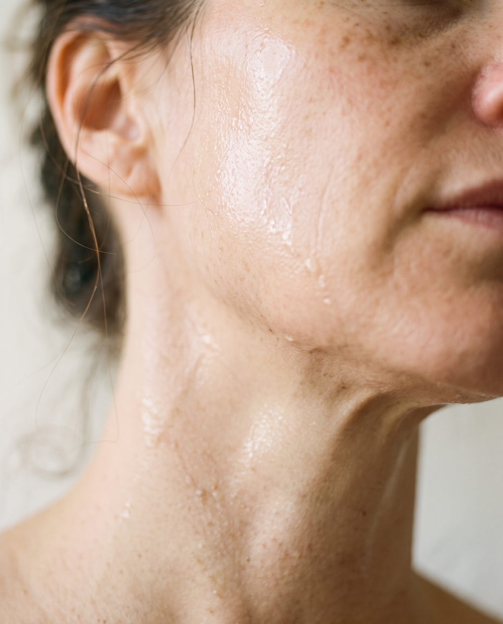 Close-up of serum on the jaw and neck